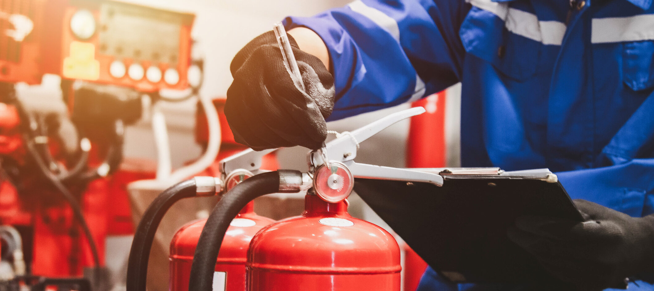 Engineer check fire suppression system,check fire extinguisher tank in the fire control room for safety